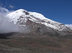 Ecuador Chimborazo 03-03 Chimborazo And Refuge From Dirt Road Here is a view of Chimborazo from the dirt road in Chimborazo National Park. To the left are the glaciers of the Ventimilla (6267m) summit, to the right the Whymper (6310m, Main) summit, and below the Carrel Refuge (4800m).